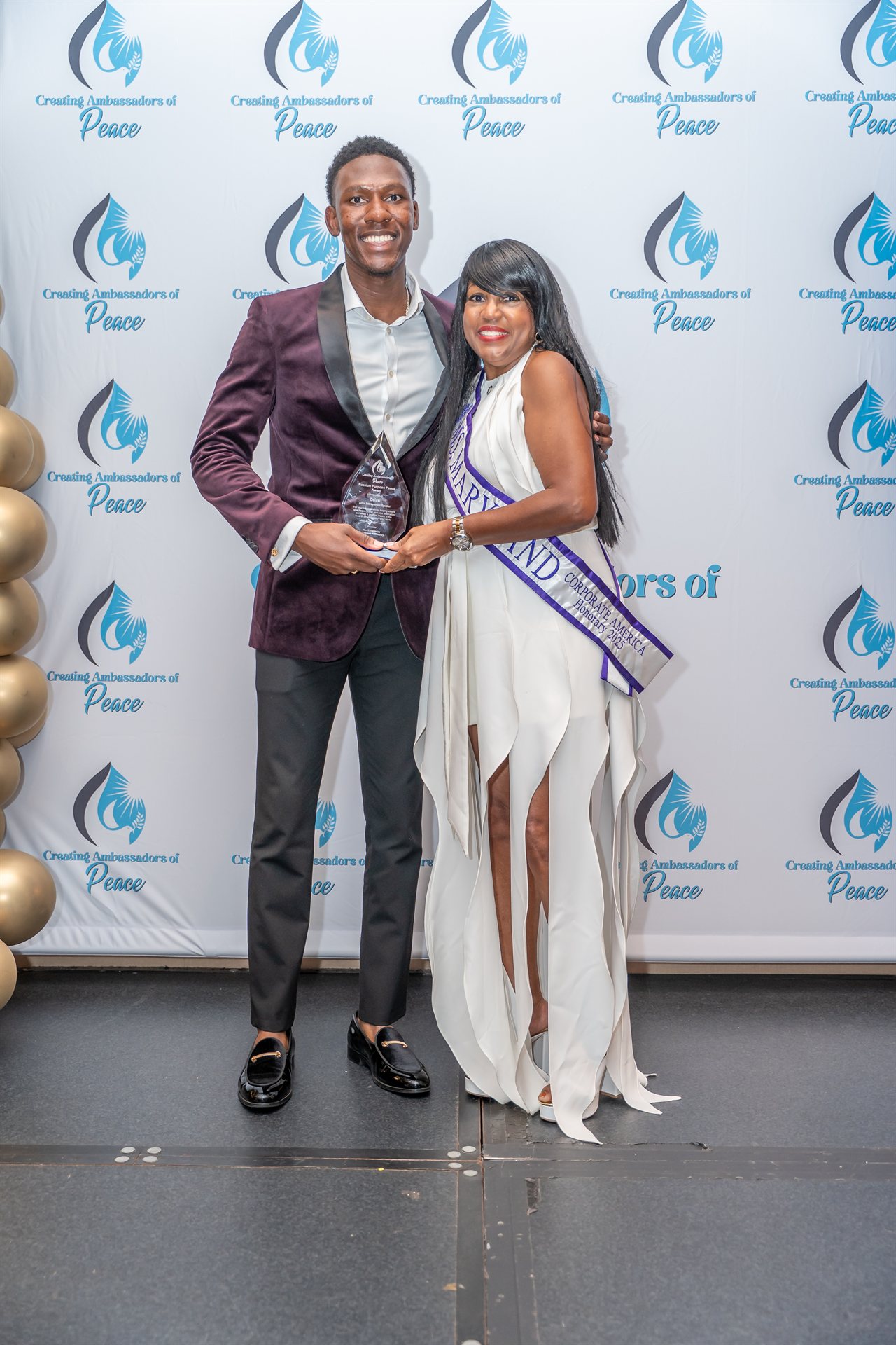 Delasi receiving award — Creating Ambassadors of Peace